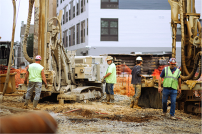 Workers near Micropile Equipment